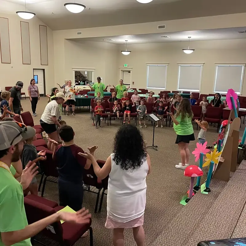 Kids singing and worshiping at a Crosspoint Church children's event